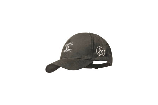 Close-up of embroidered Local Say Torono wordmark on microsuede cap